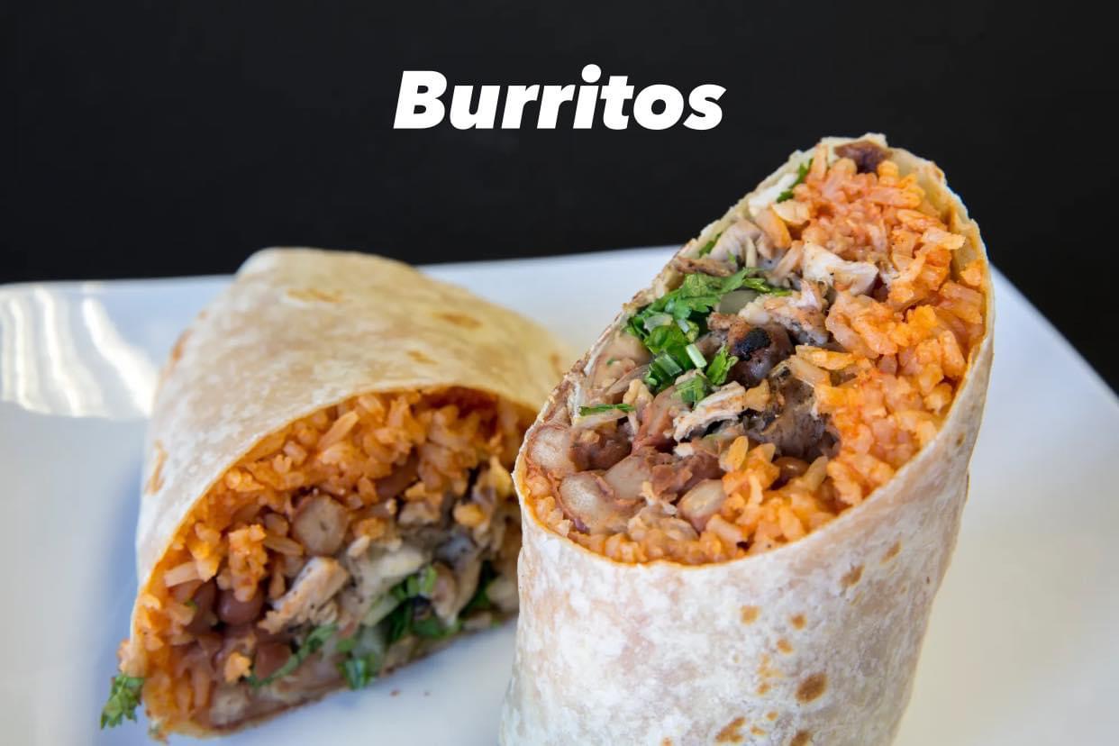 A burrito with rice, beans and meat.